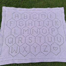 Hexie ABCs is a Filet Crochet Baby Blanket Pattern - shown in Orchid